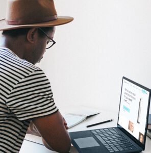 African American man looking at laptop screen