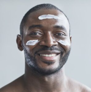 African American man with face cream