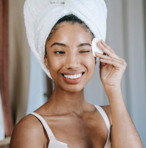 Woman cleaning her face