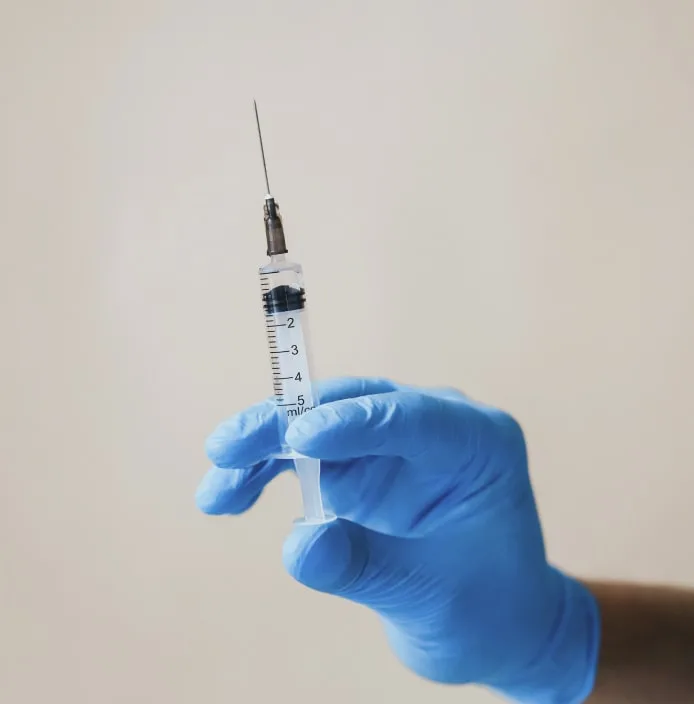 hand holding surgical needle