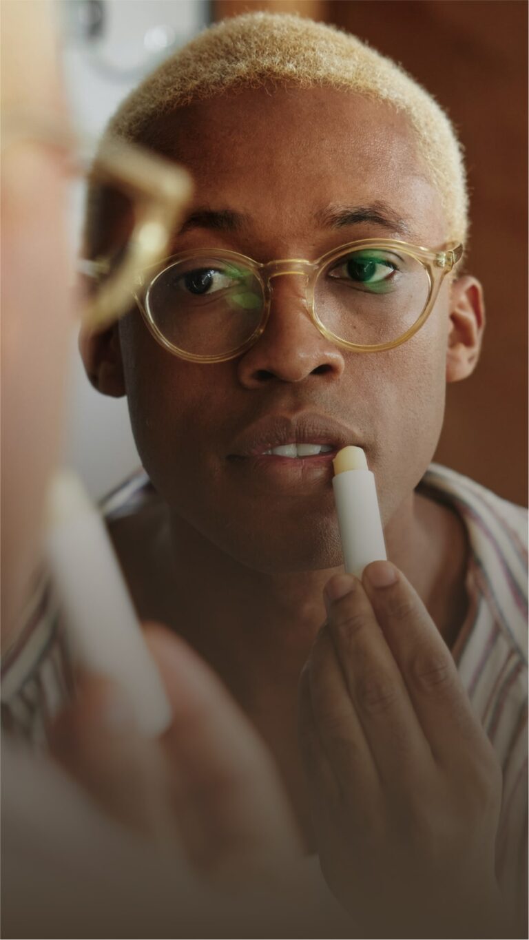a man applying lip balm