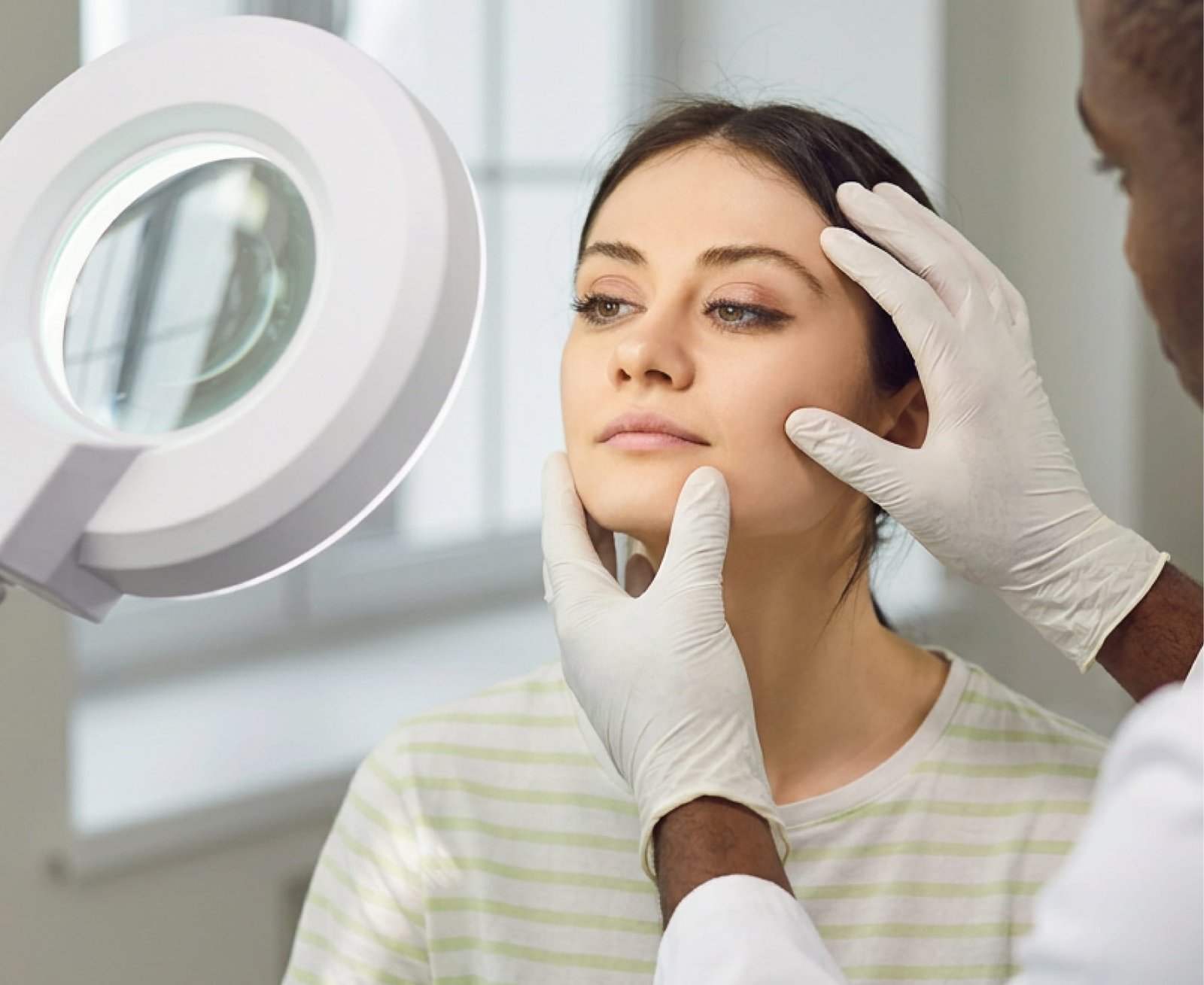 doctor inspecting skin
