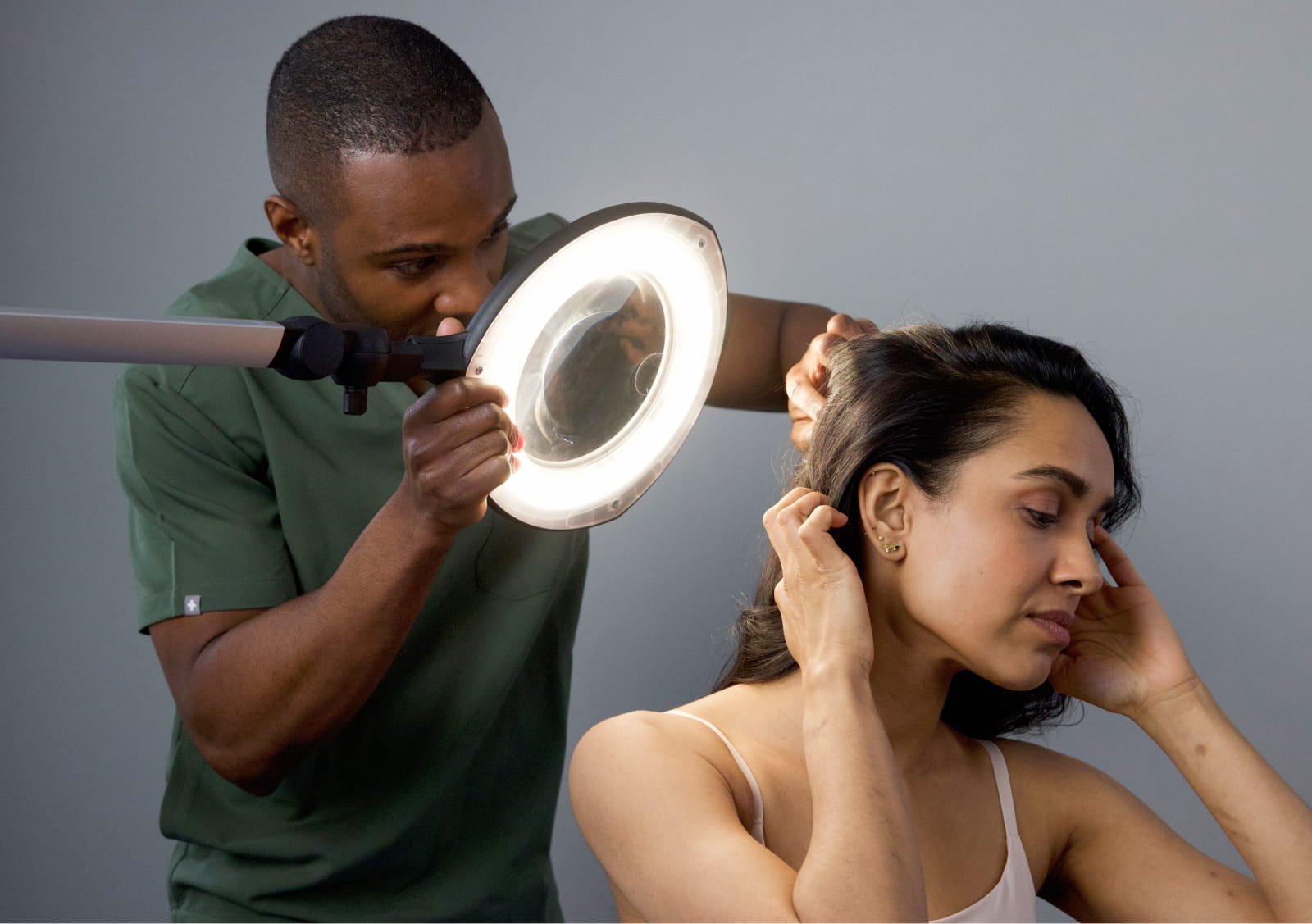 dr derrick checking hair compresses